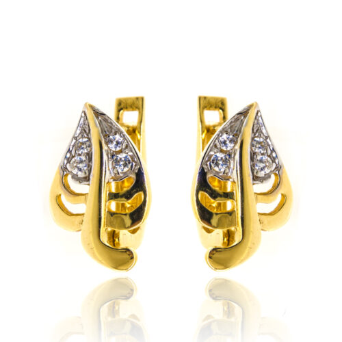 Złota bransoletka z cytrynami na tle marmuru.