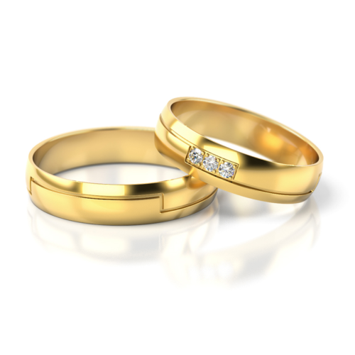 Obrączki ślubne w kształcie serca na białym tle.