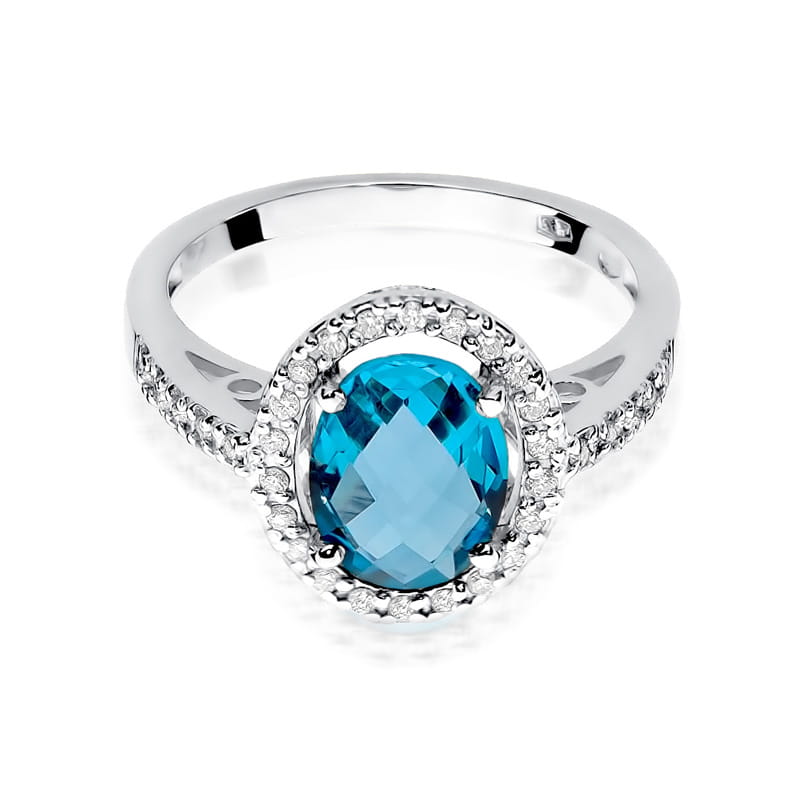 W0080.B3.TOB.01_2 Srebrny pierścionek z owalnym, niebieskim kamieniem otoczonym drobnymi diamentami.