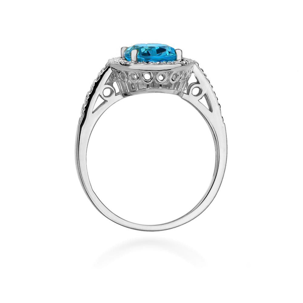 W0080.B3.TOB.01_3 Srebrny pierścionek z niebieskim kamieniem szlachetnym, ozdobiony delikatnymi detalami.