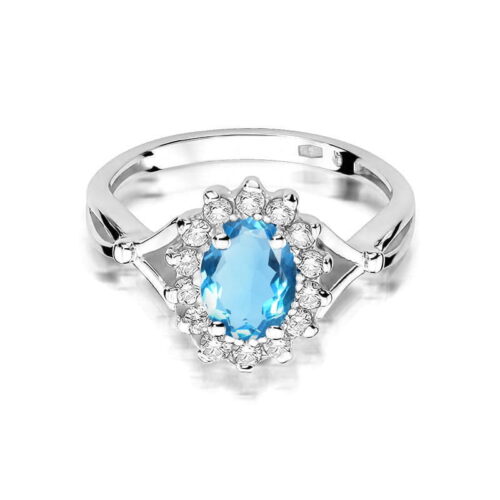 Srebrny pierścionek z owalnym, niebieskim kamieniem otoczonym przez małe, przezroczyste kryształy.