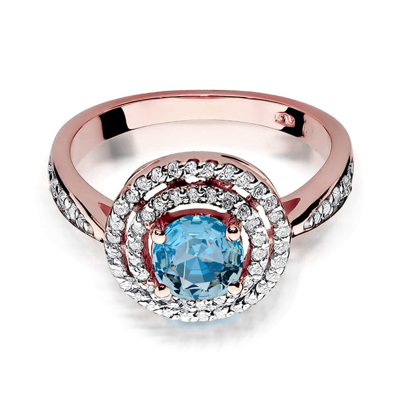 W0274.R3.TOB.01_2 Różowe złoto pierścionka z dużym niebieskim kamieniem otoczonym diamentowymi cyrkoniami.