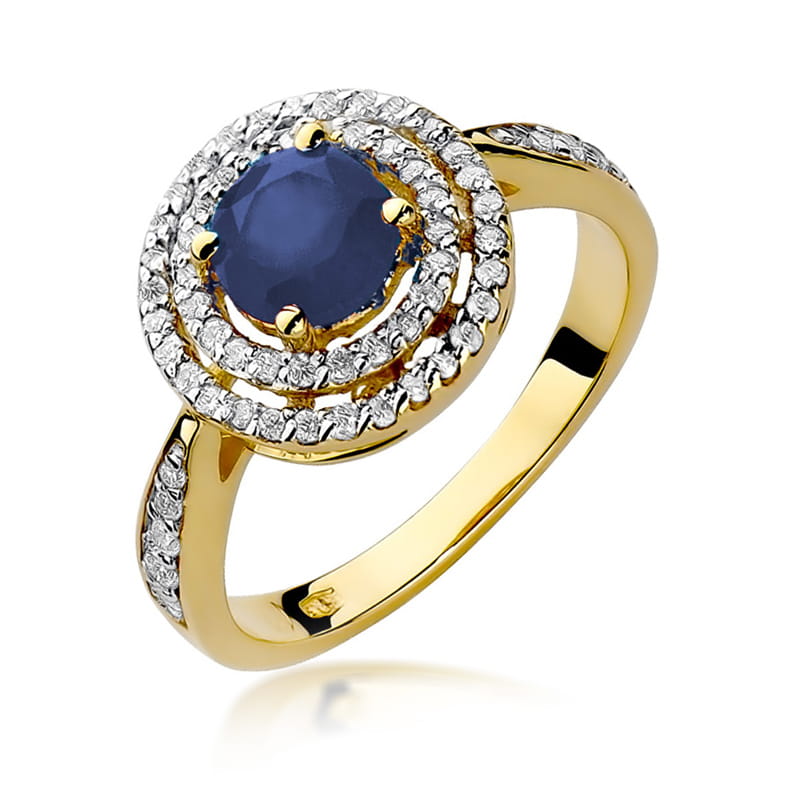 W0274.Z3.SAB.01_1 Złoty pierścionek z okrągłym niebieskim kamieniem otoczonym diamentowymi zdobieniami.