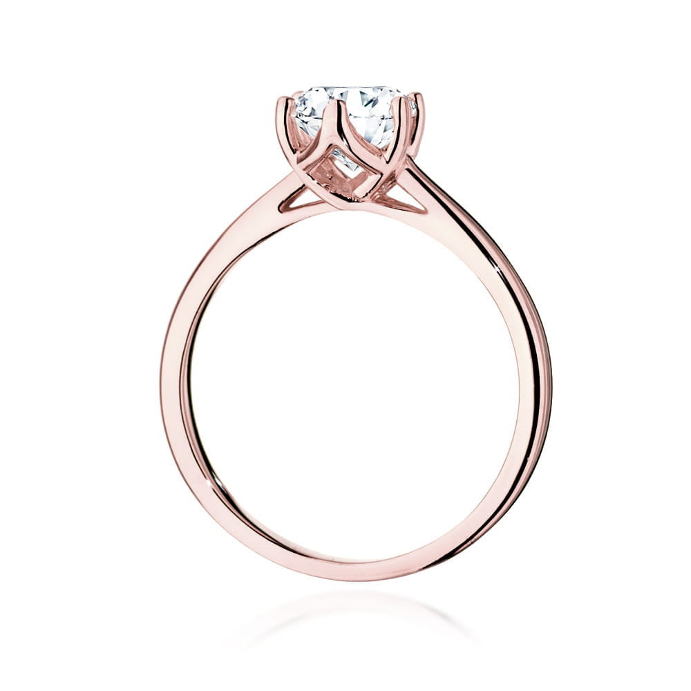 W0540.R3.LDW.05_3 Różowe złote pierścionek z diamentem w centralnej części, o eleganckim, minimalistycznym designie.