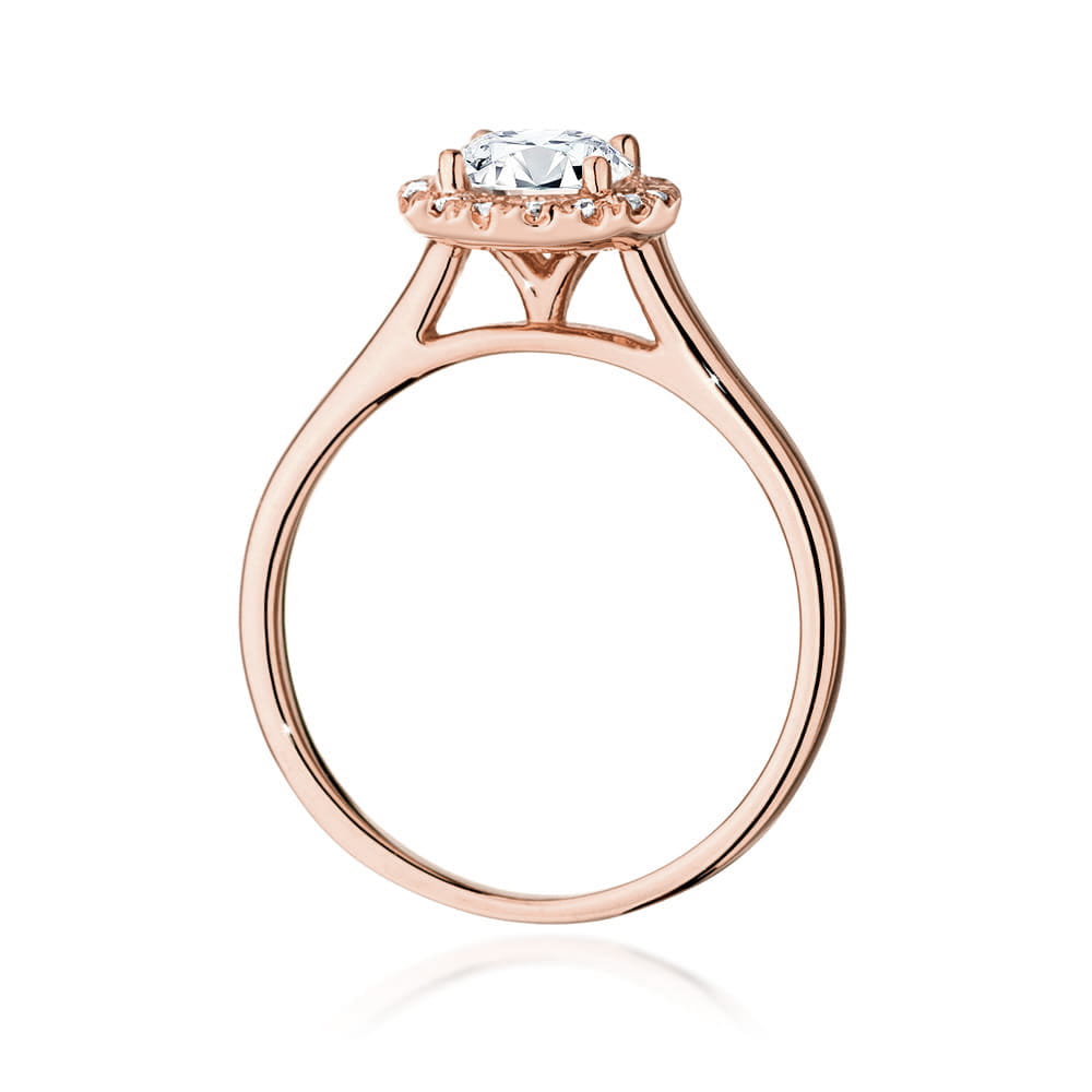 W0550.R3.LDW.03_3 Różowe złoto pierścionka zaręczynowego z dużym diamentem i drobnymi kamieniami wokół.